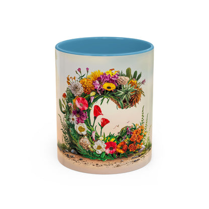 Mug with floral design and blue interior on a white background