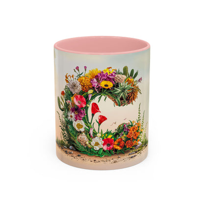 Mug with floral design and pink interior on a white background