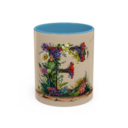 Mug with floral design and blue interior on a white background