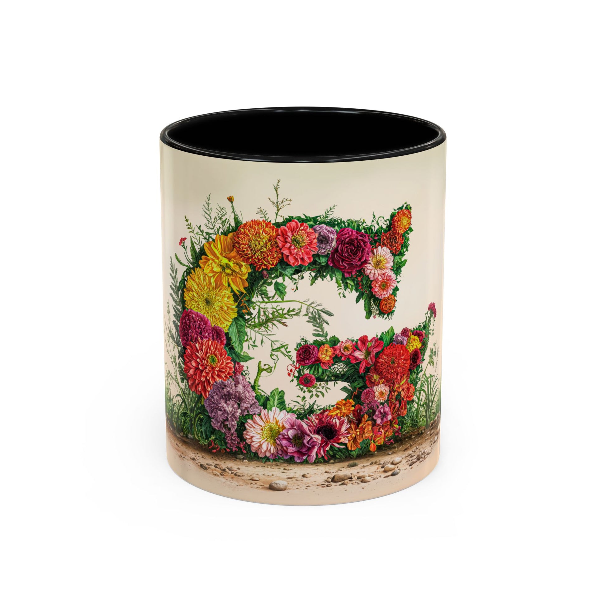 Mug with floral design and letter 'G' on a white background