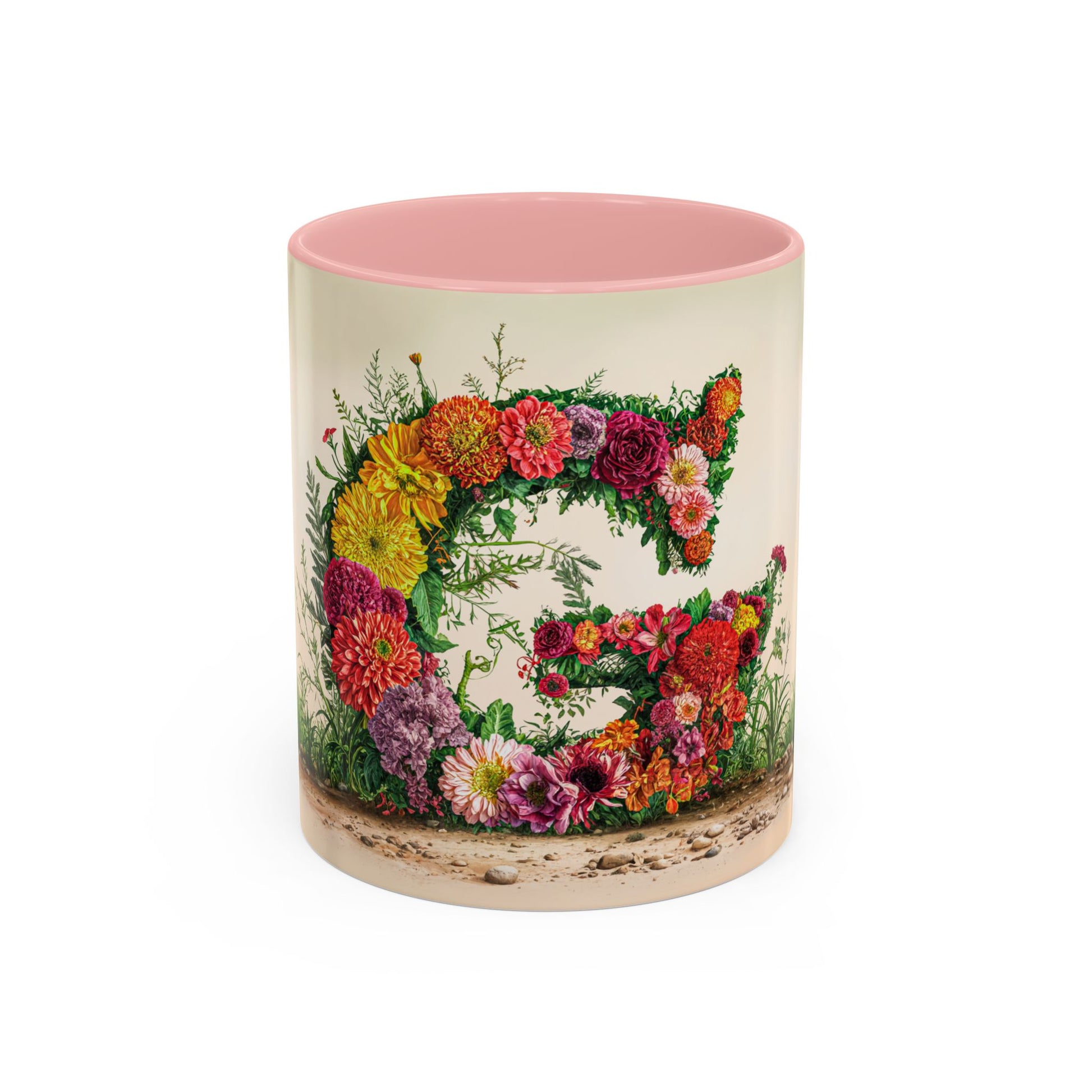 Mug with floral design and pink interior on a white background
