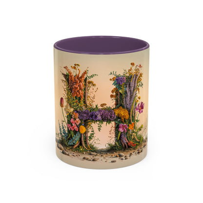 Mug with floral design and letter 'H' on a beige background