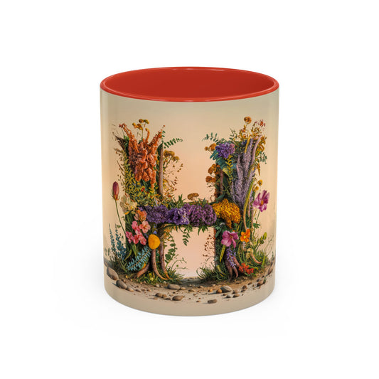 Mug with floral design in the shape of the letter 'H' on a beige background