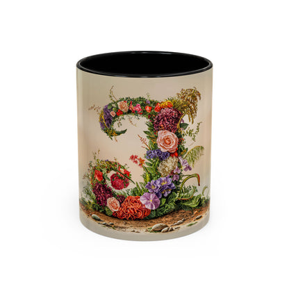 Mug with floral design and letter J on a white background