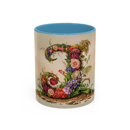Mug with floral design and blue interior on a white background