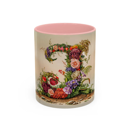 Mug with floral design and pink interior on a white background