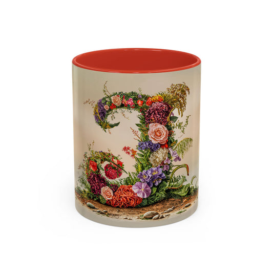 Mug with floral design and red interior on a white background