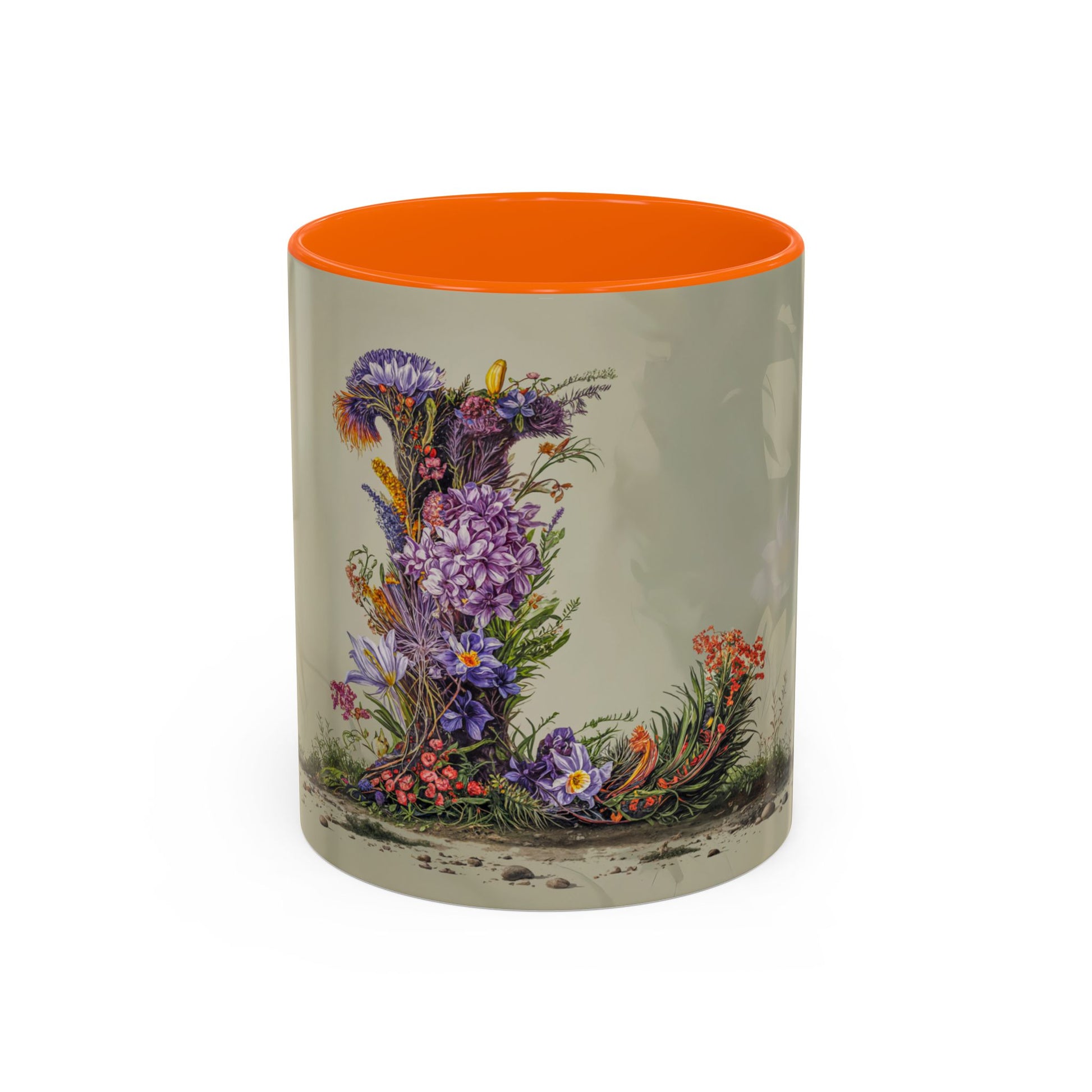 Mug with floral design and orange interior on a beige background