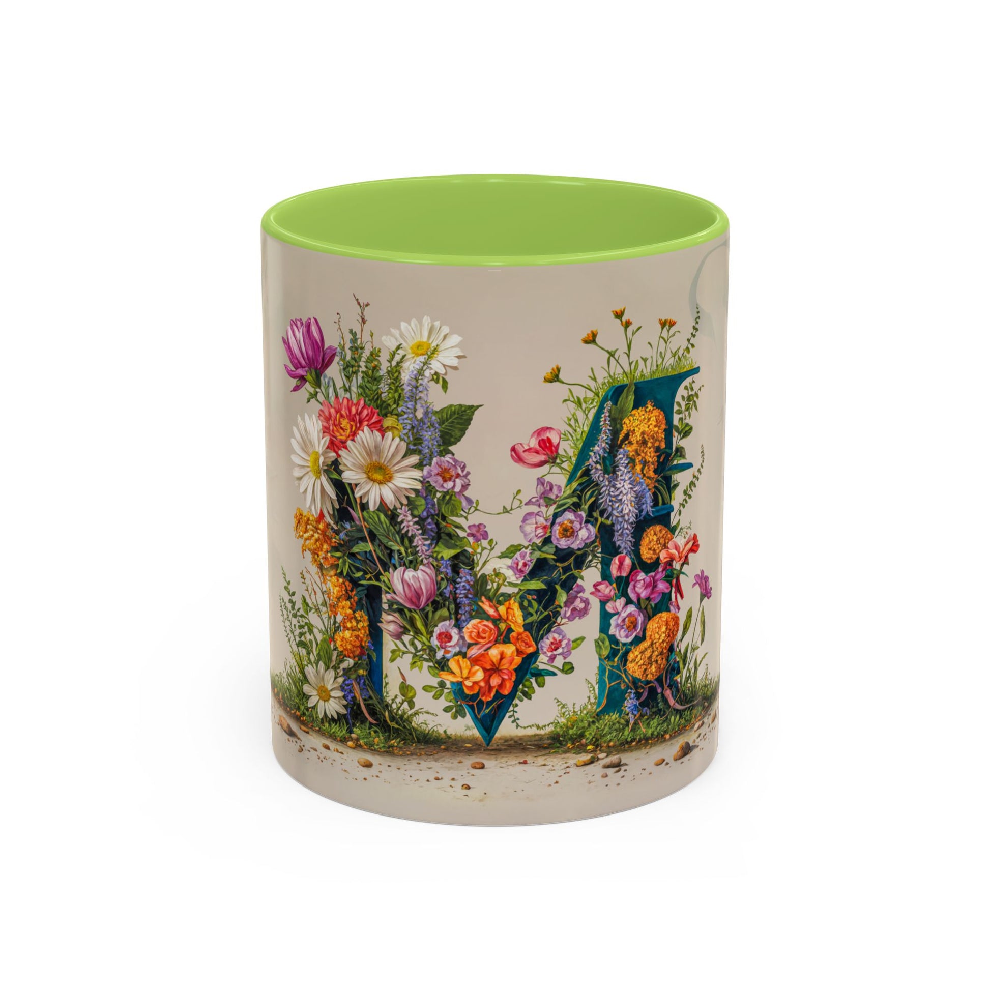 Mug with floral design and green interior on a white background