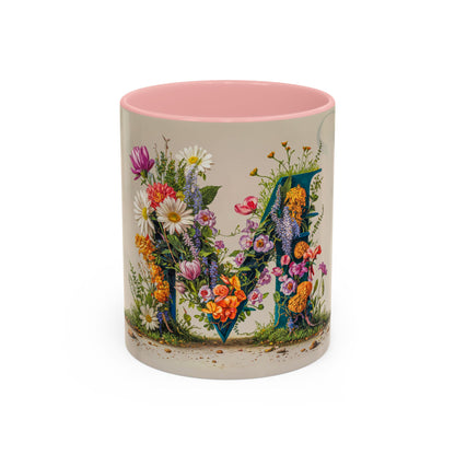 Mug with floral design and pink interior on a white background