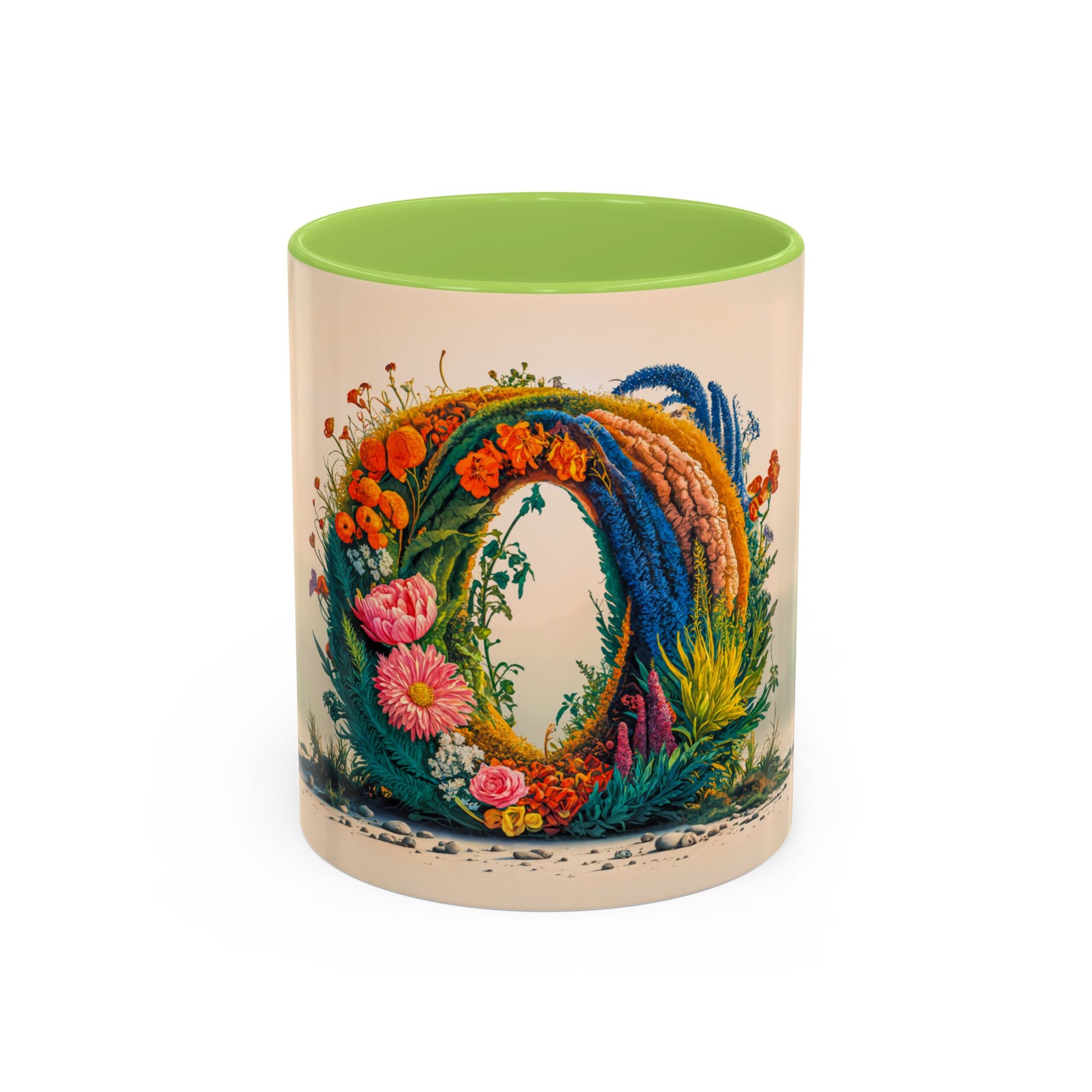 Decorative mug with floral design and green interior on a white background