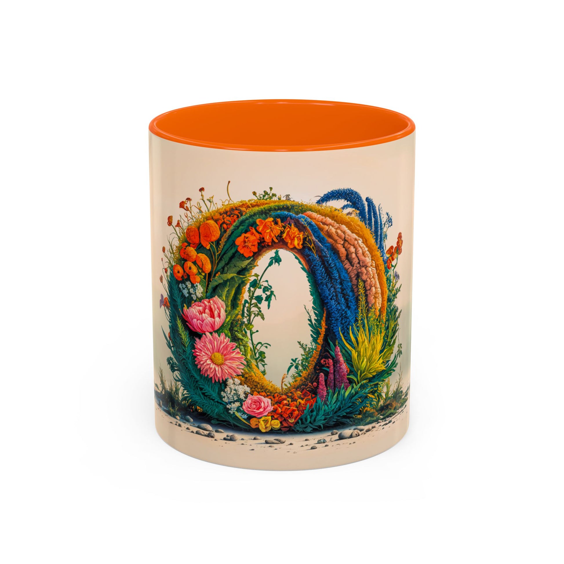 Decorative mug with floral design and orange interior on a white background