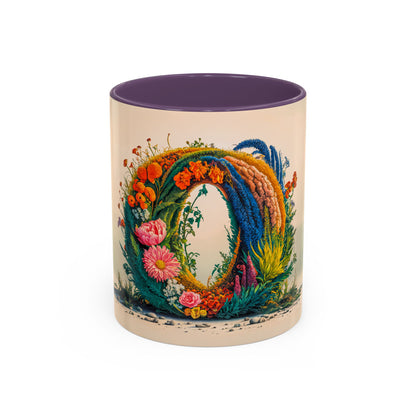 Decorative mug with floral design and purple interior on a white background