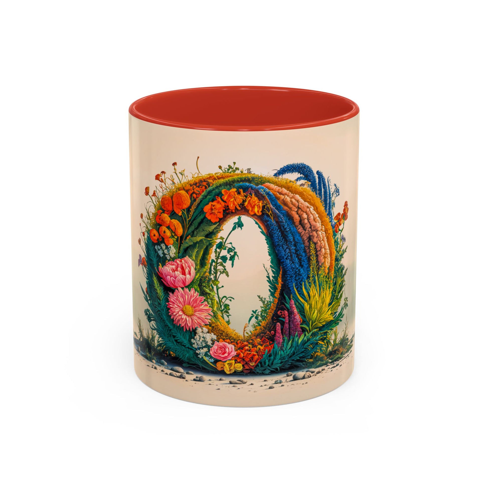Decorative mug with floral design and red interior on a white background