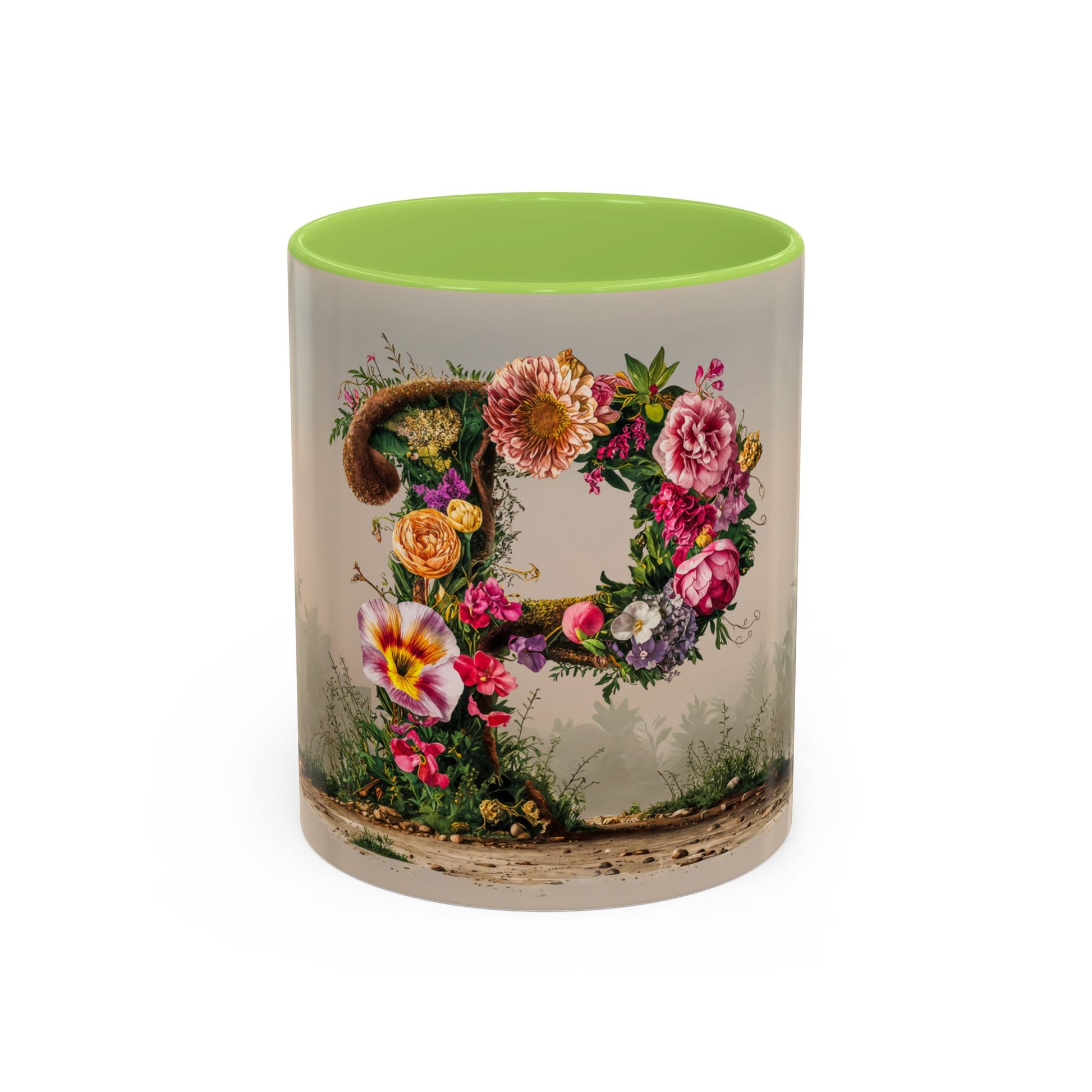Mug with floral design and green interior on a white background