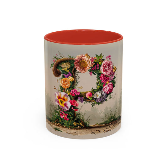 Mug with floral design and red interior on a white background