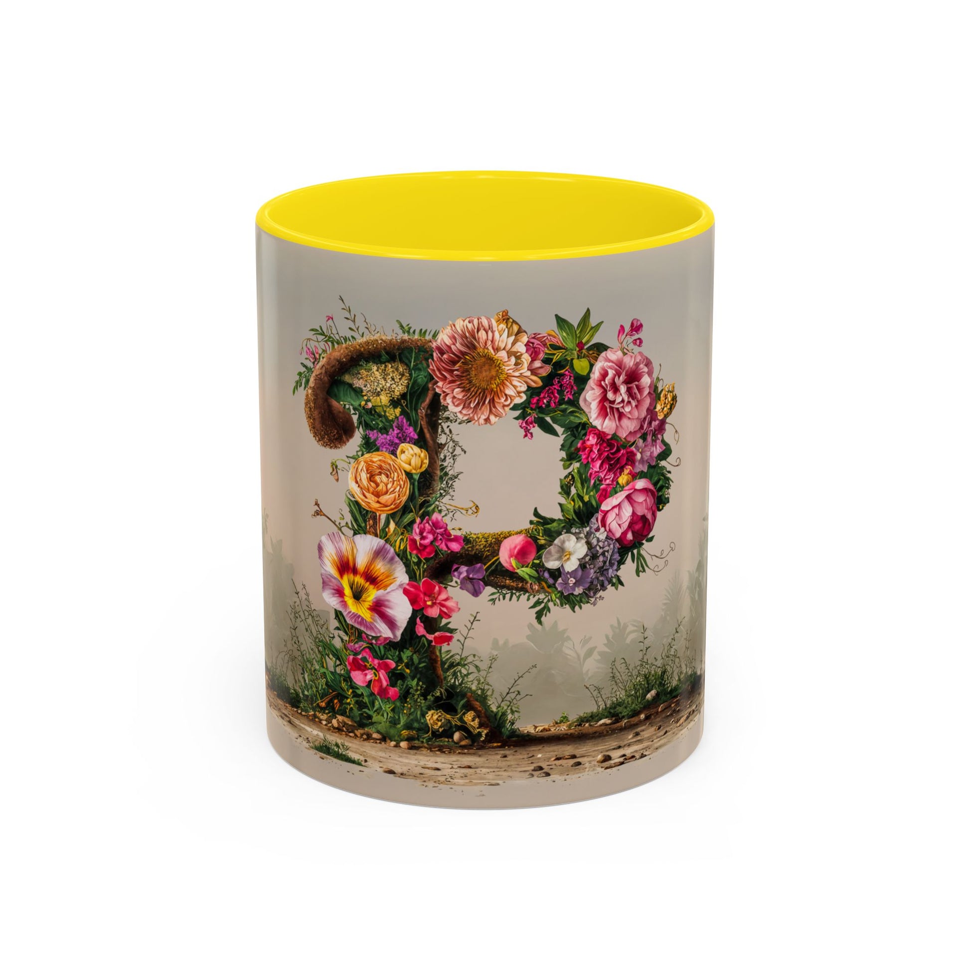 Tumbler with floral design and yellow interior on a white background