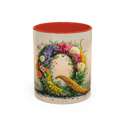 Mug with floral design and red interior on a white background