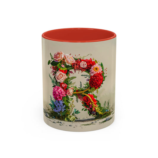Mug with floral design and red interior on a white background