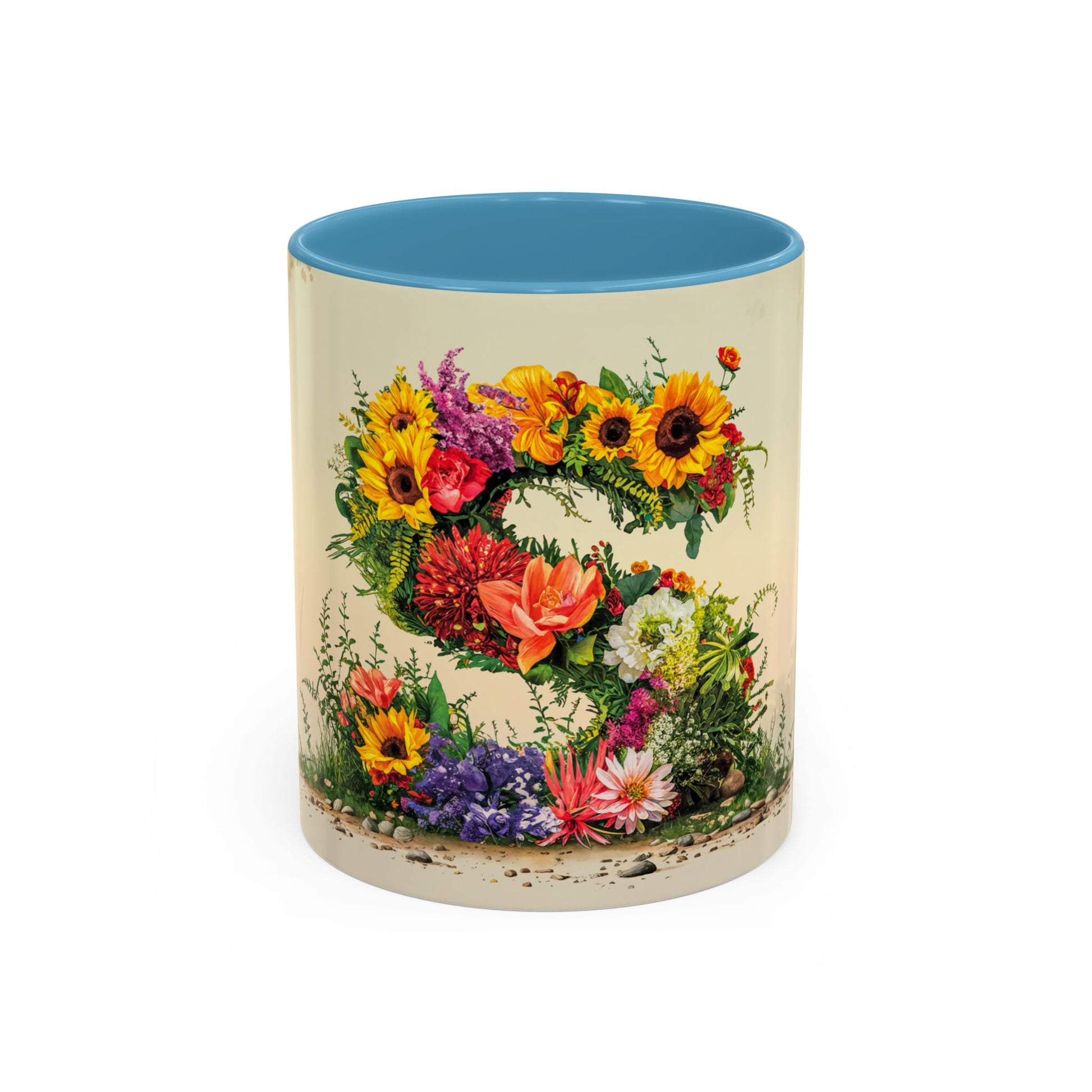 Mug with floral design and blue interior on a white background