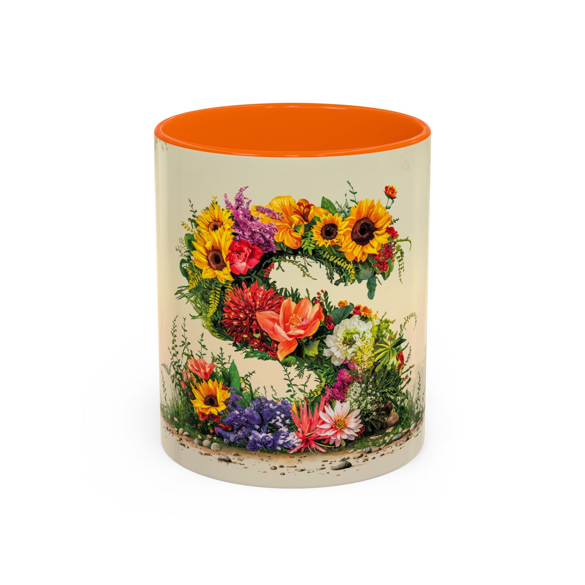 Mug with floral design and orange interior on a white background