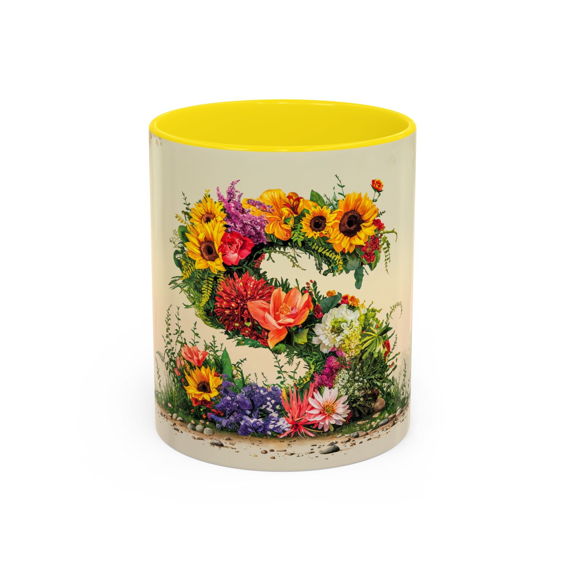 Mug with floral design and yellow interior on a white background