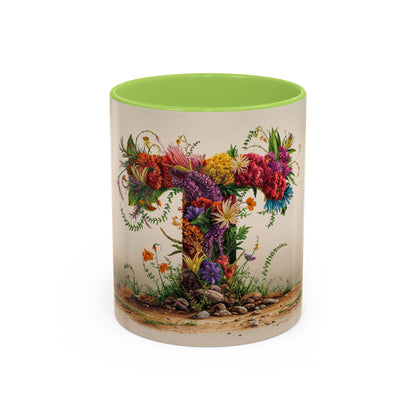 Mug with floral design and green interior on a white background