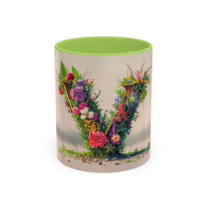 Mug with floral design and green interior on a white background