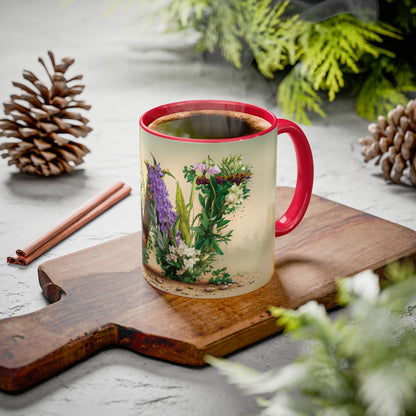 Mug with floral design on a wooden board with pine cones and cinnamon sticks.