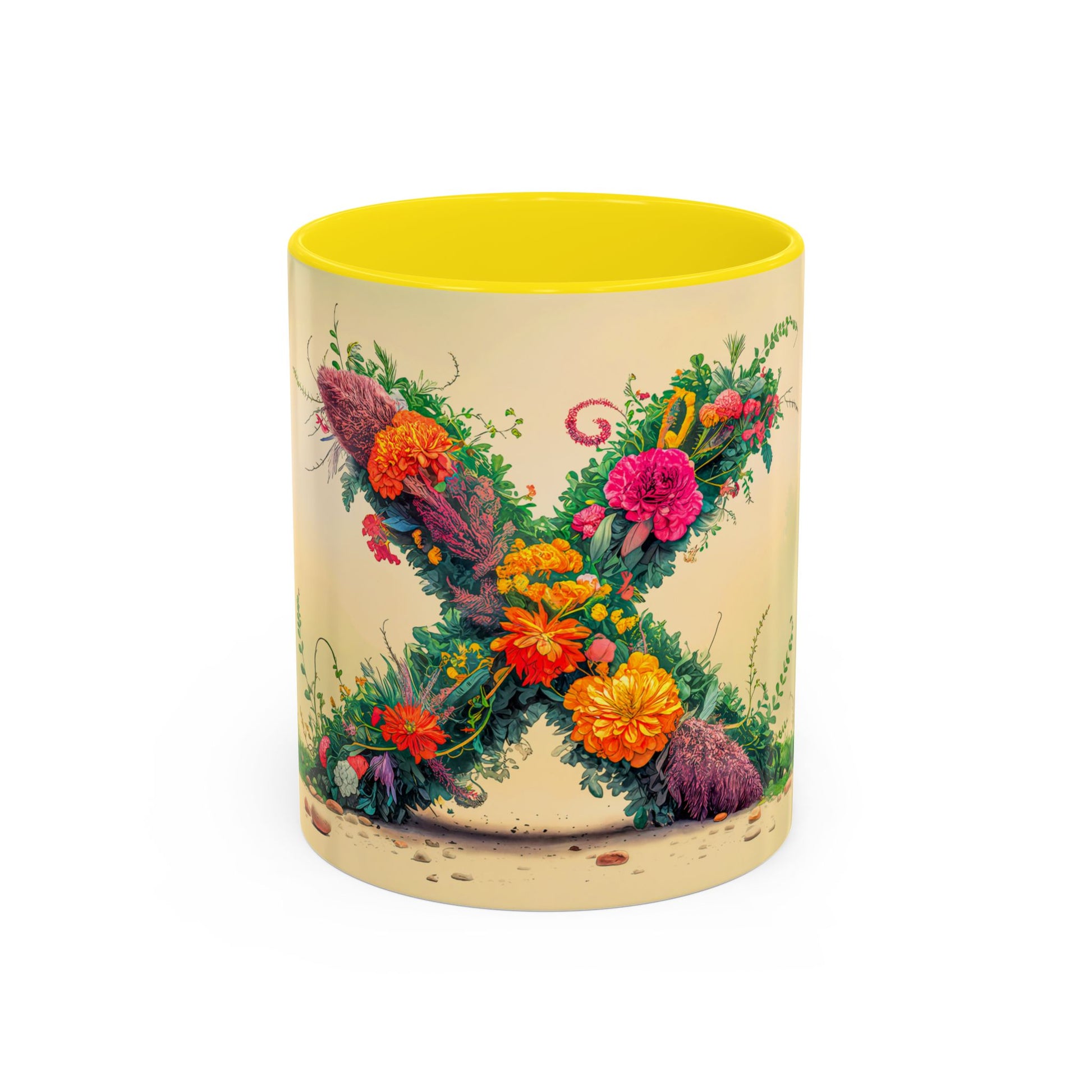 Mug with floral design and yellow interior on a white background