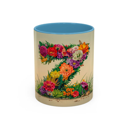 Mug with floral design and blue interior on a beige background