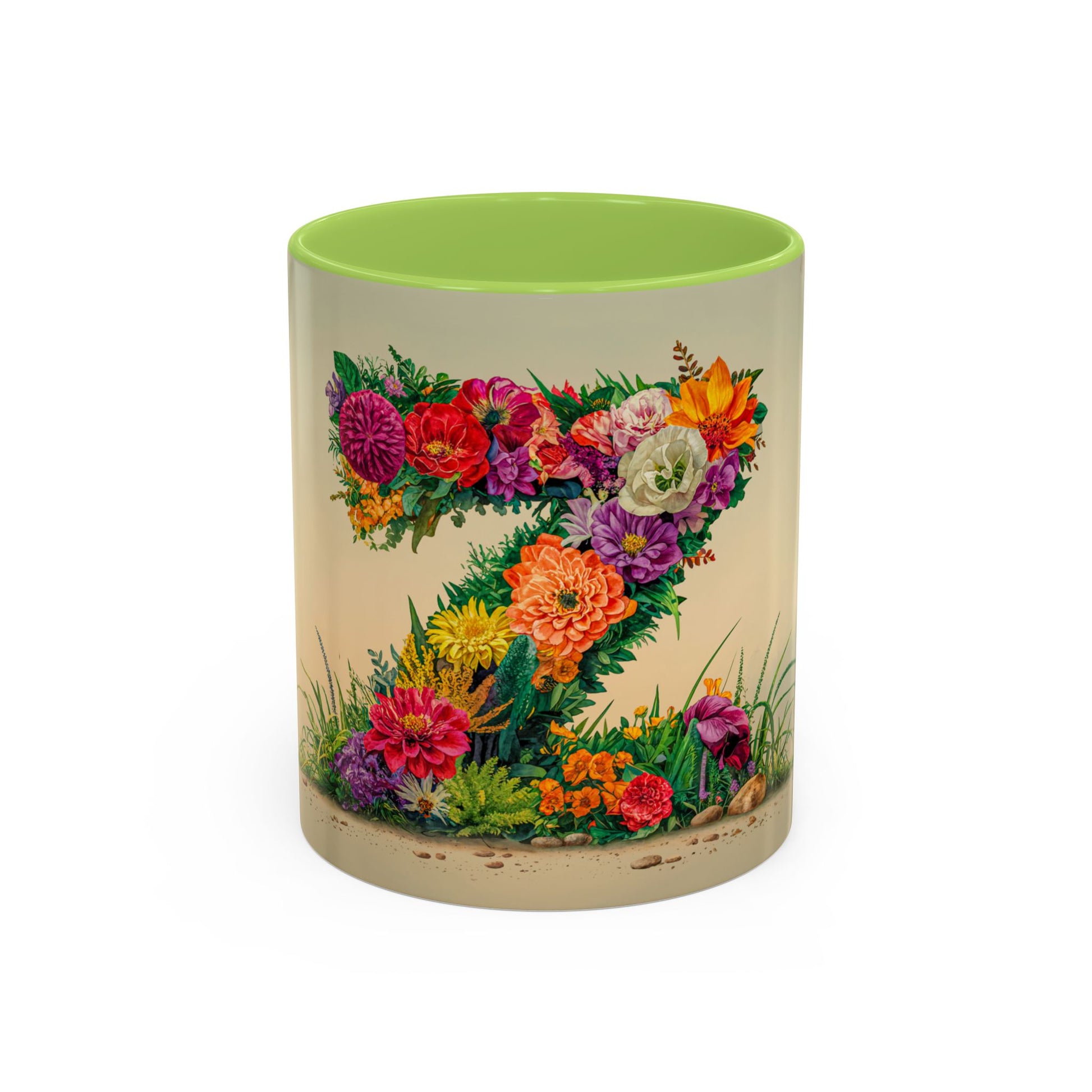 Mug with floral design and green interior on a white background
