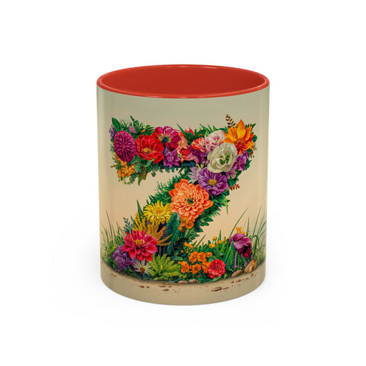 Mug with floral design and red interior on a beige background