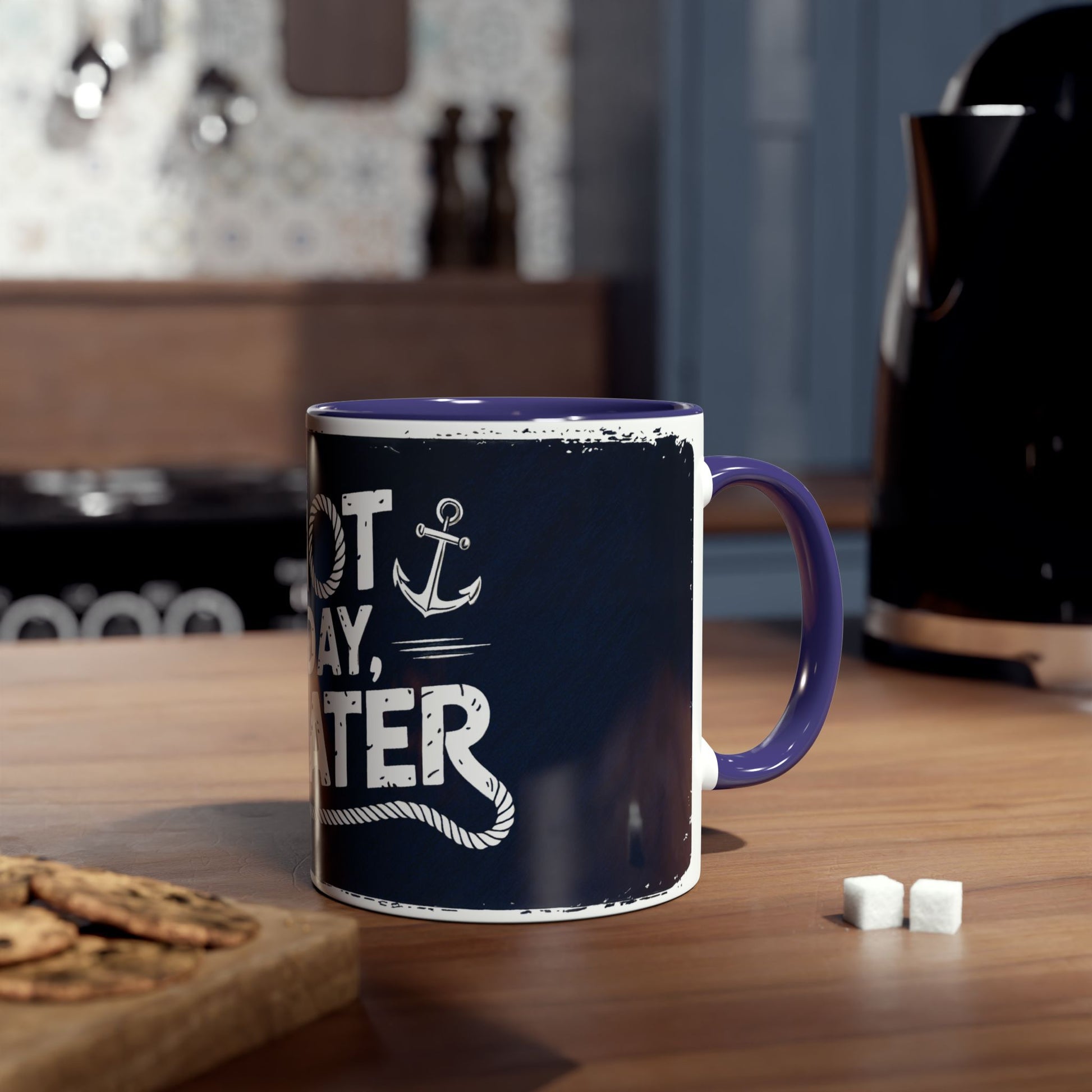 Navy blue mug with white text on a wooden table