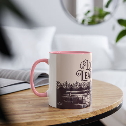 Mug with pink interior and handle on a wooden table with a blurred background