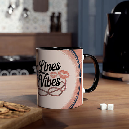 Mug with lipstick design on a kitchen counter with cookies and sugar cubes.