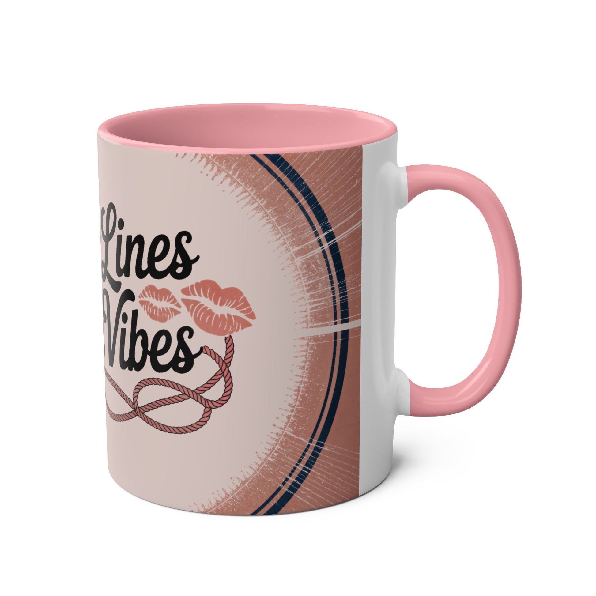 Mug with pink interior and handle, featuring a design and text on a white background