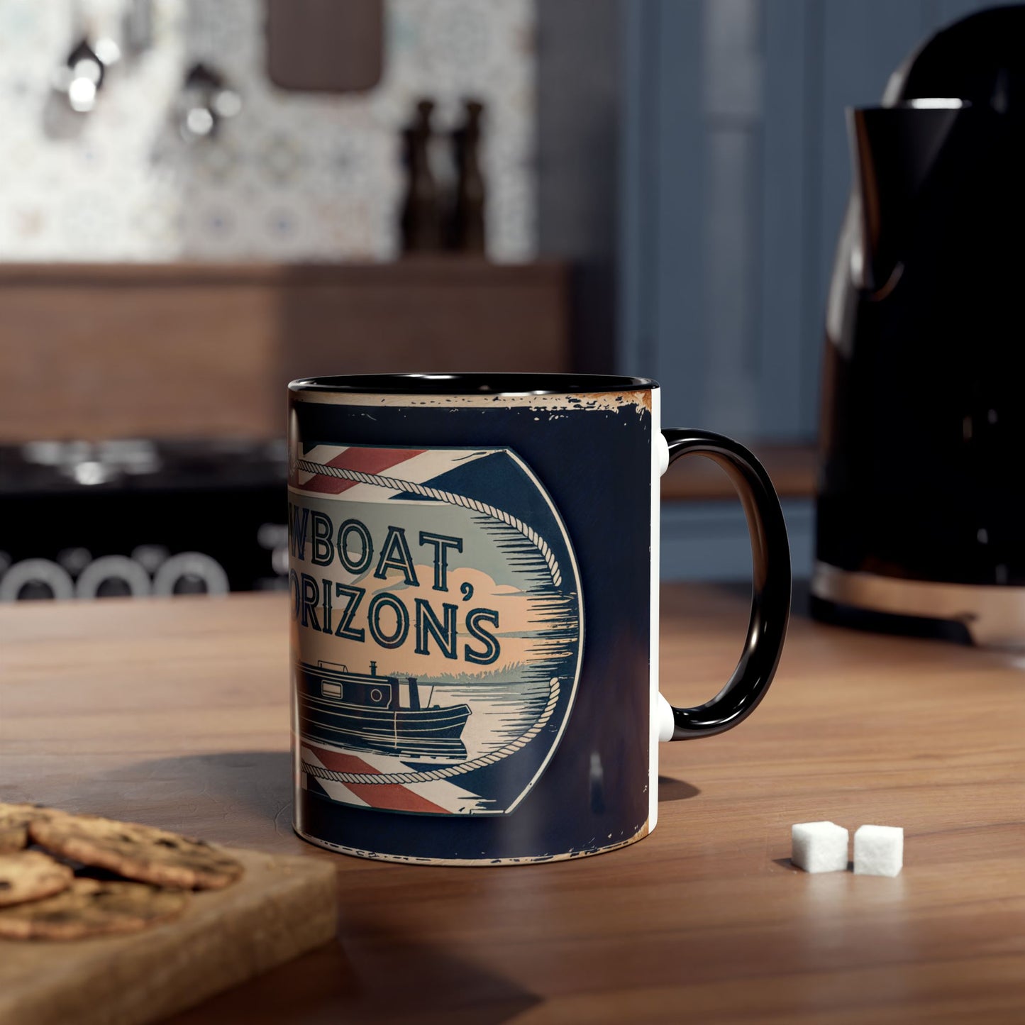 Mug with narrowboat design on a wooden table with cookies and sugar cubes.