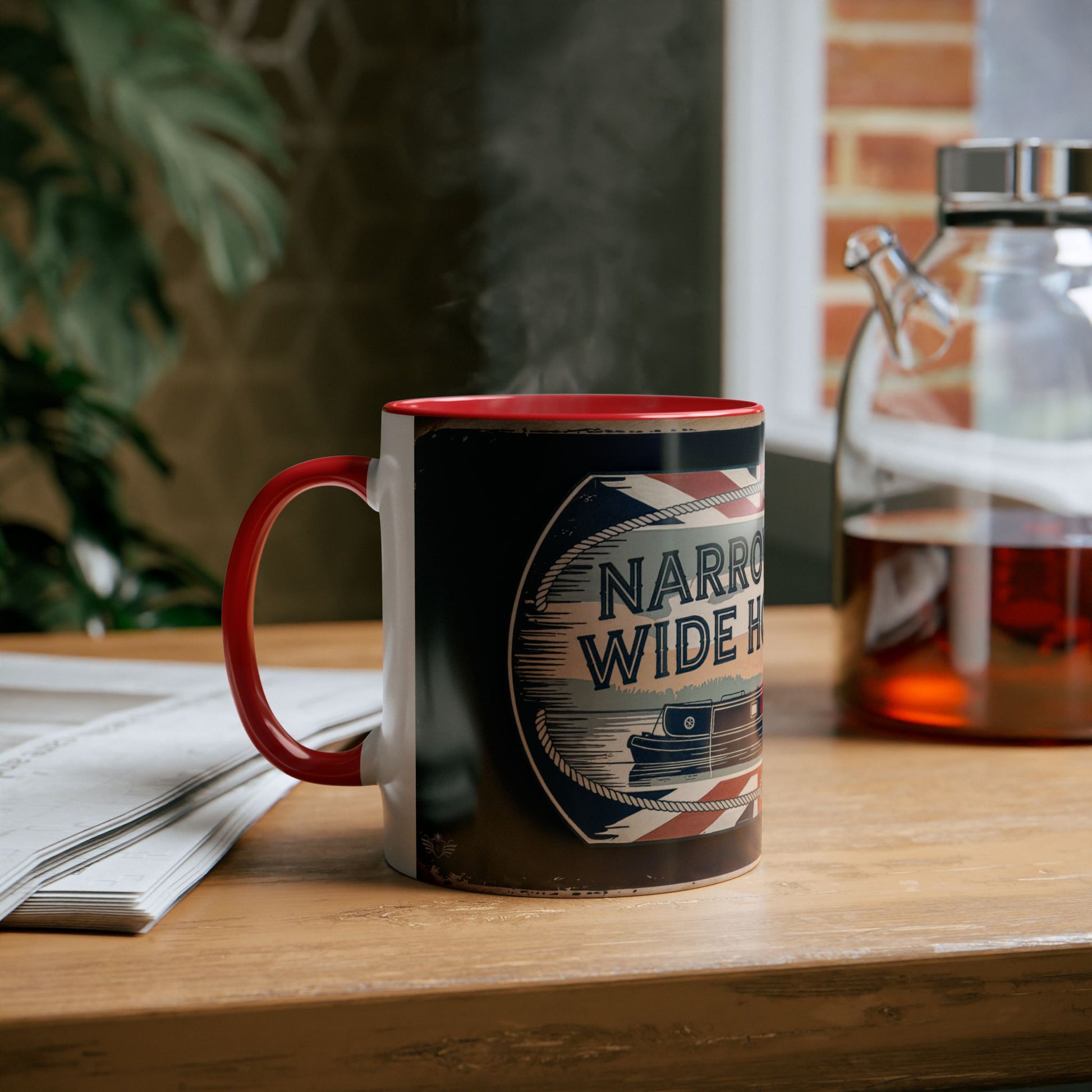 Mug with narrowboat design and text on a wooden table with a blurred background