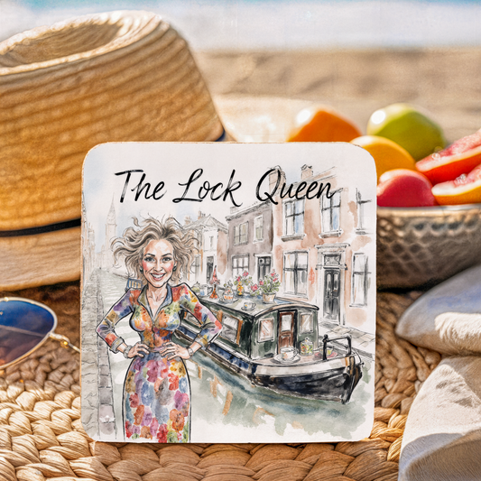 Coaster with illustration of a woman and canal boat, labeled "The Lock Queen", on a woven surface with fruit.